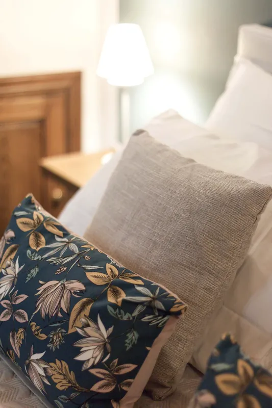 Blue bedroom · patterned cushions