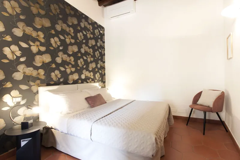 Floral bedroom · bed and armchair