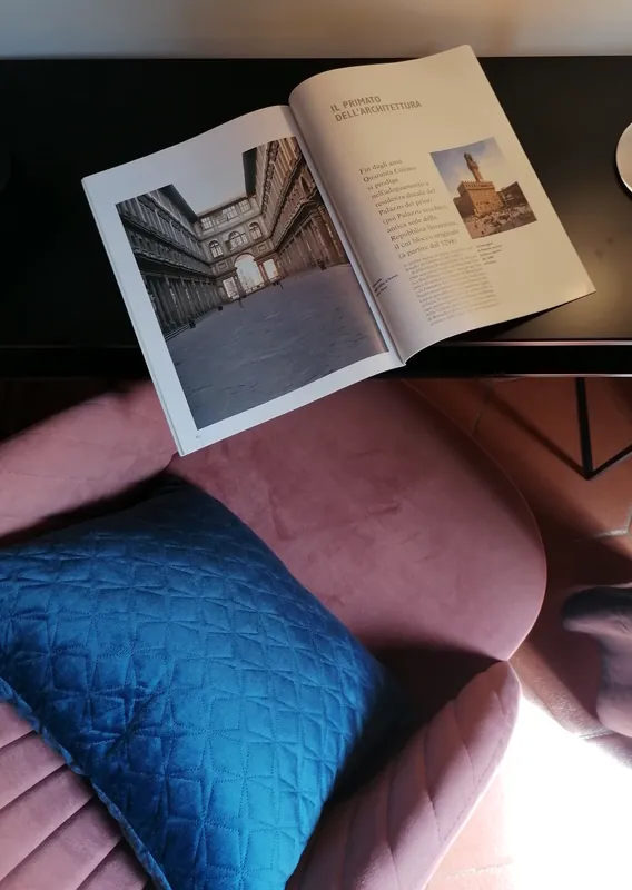 Floral bedroom · armchair and open book