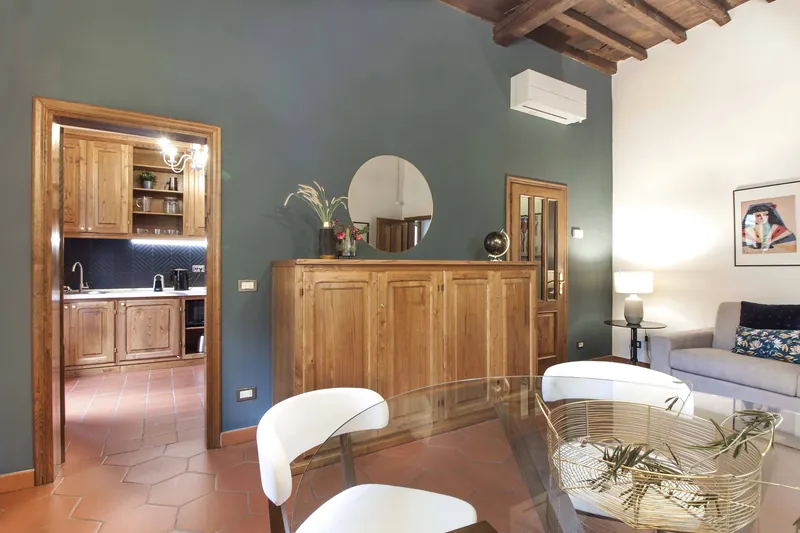 Living and dining room · wooden sideboard and kitchen doorway