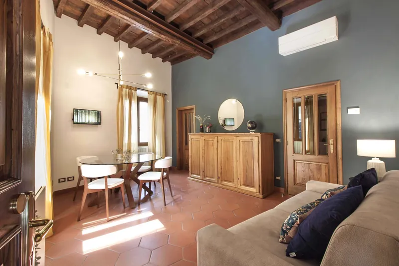 Living room · sofa, dining table and exposed beams