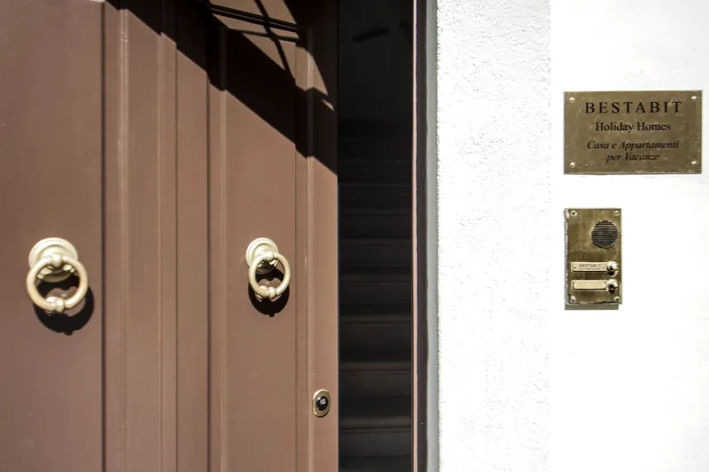 Private street entrance with BestAbit plaque and intercom