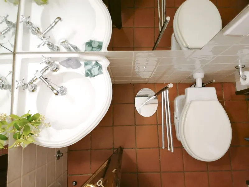 Shared service bathroom · basin, mirror and WC